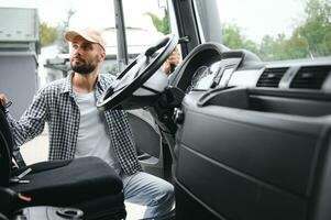 Photo of motivated truck driver entering his semi truck long vehicle. Happy trucker. Transportation service