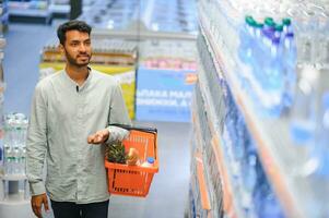 Man at grocery store products photo