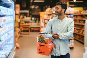 Man at grocery store products photo