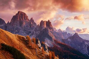 ai generado asombroso ver de rocoso picos, iluminado por un calentar puesta de sol brillo, rodeado por el vibrante colores de otoño follaje, exhibiendo naturaleza grandeza. foto