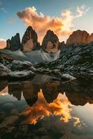 AI generated A breathtaking sunset illuminates towering rocky peaks, casting a warm glow that is beautifully mirrored in the tranquil waters below. photo