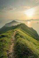 AI generated a breathtaking view of a narrow trail on a lush green mountain ridge. The sun is setting in the background, casting a warm glow over the scene and illuminating the ocean below. photo