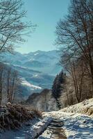 AI generated A breathtaking snowy landscape featuring a winding path, bare trees, and majestic mountains under a clear blue sky. photo