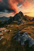 AI generated Breathtaking sunset over rugged mountains, illuminating a serene landscape with a dramatic sky and rocky terrain photo