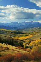 AI generated Breathtaking autumn scenery with vibrant foliage, majestic mountains backdrop, and a dynamic cloudy sky. photo