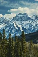 AI generated A breathtaking view of snow-capped mountains, surrounded by lush green pine trees under a serene blue sky with fluffy white clouds. photo