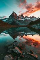 AI generated A breathtaking sunset illuminating majestic mountains, mirrored perfectly in a tranquil lake below. A serene and awe-inspiring natural landscape. photo