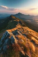 ai generado un montañoso paisaje durante puesta de sol. rocoso terrenos con parches de césped son prominentemente Destacados en el primer plano. el luz de sol yesos un dorado matiz en el rocas y césped foto