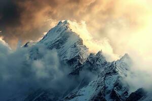 ai generado majestuoso cima, nubes abarcar, dorado puesta de sol resplandor ilumina Nevado montaña. foto