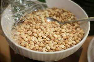 the plate contains refried beans and a spoon ready to eat photo