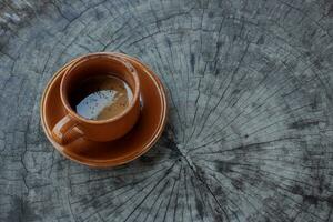 Coffee cup over wooden wrapped Christmas holiday rustic table background. view from above. space for text. photo