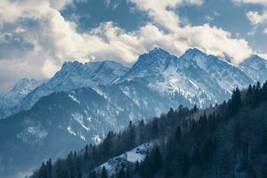 AI generated The image captures a breathtaking view of snow-capped mountain peaks. The mountains are rugged and majestic, with shadows casting intricate patterns on their slopes. photo