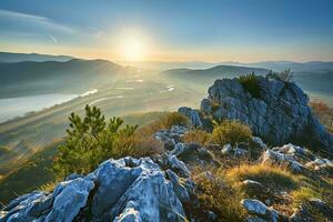 AI generated a golden sunrise illuminating misty valleys, rugged rocks foreground, vibrant greenery amidst serene mountains. photo