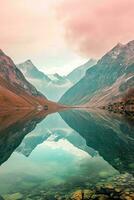 ai generado un tranquilo escena de montañas reflejado en un claro lago debajo un suave rosado y azul degradado cielo. el agua es entonces claro ese rocas foto