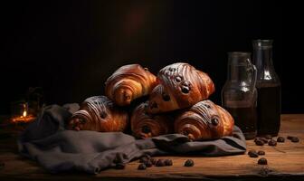 AI generated Chocolate croissants are sitting on a table on a dark background photo