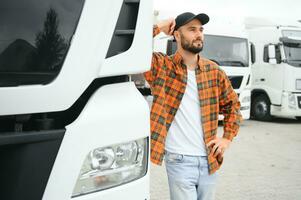 Portrait of confident truck driver on parking lot. Copy space photo