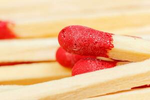 matches with a red head on a white background photo