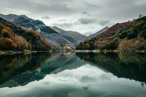 AI generated a tranquil scene of a lake surrounded by autumn-colored mountains under a cloudy sky, showcasing nature beauty. photo