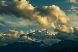 AI generated Breathtaking view of snowy mountains under a sky filled with fluffy, golden-hued clouds at sunset. photo