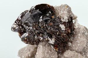 Macro of mineral Sphalerite stone on microcline on white background photo