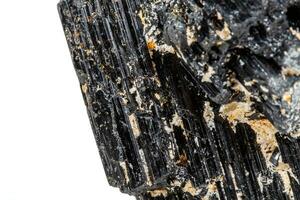 macro mineral stone sherle, schorl, black tourmaline on white background photo