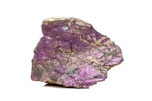 Macro mineral stone purpureus, purple purpurite in the breed a white background photo