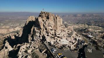 Aerial drone view of the Uchisar Castle in Cappadocia, Turkey. This tall volcanic-rock outcrop is one of Cappadocia's most prominent landmarks and visible for miles around. video