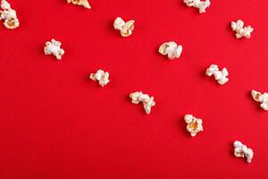 popcorn macro on a red background photo