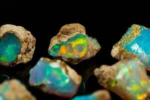 macro mineral stone rare and beautiful opals on a black background photo