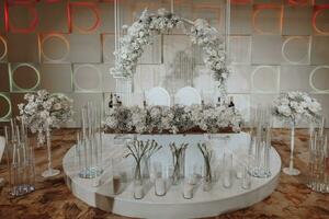 wedding table bride and groom decorated with flowers. Details on a floral arrangement of dried and fresh flowers photo