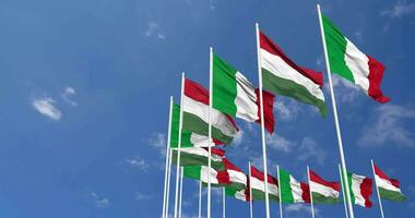 Hungary and Italy Flags Waving Together in the Sky, Seamless Loop in Wind, Space on Left Side for Design or Information, 3D Rendering video