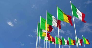 Mali and Italy Flags Waving Together in the Sky, Seamless Loop in Wind, Space on Left Side for Design or Information, 3D Rendering video