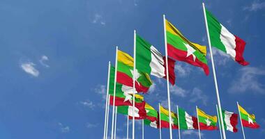 Myanmar, Burma and Italy Flags Waving Together in the Sky, Seamless Loop in Wind, Space on Left Side for Design or Information, 3D Rendering video