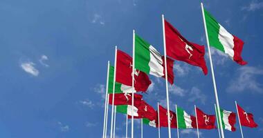 Isle of Man and Italy Flags Waving Together in the Sky, Seamless Loop in Wind, Space on Left Side for Design or Information, 3D Rendering video