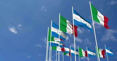 Honduras and Italy Flags Waving Together in the Sky, Seamless Loop in Wind, Space on Left Side for Design or Information, 3D Rendering video