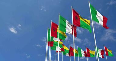 Guinea Bissau and Italy Flags Waving Together in the Sky, Seamless Loop in Wind, Space on Left Side for Design or Information, 3D Rendering video