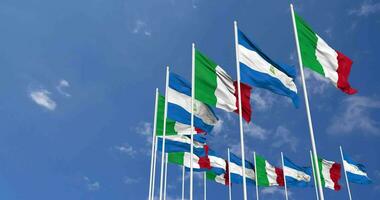 Nicaragua and Italy Flags Waving Together in the Sky, Seamless Loop in Wind, Space on Left Side for Design or Information, 3D Rendering video