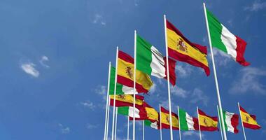 Spain and Italy Flags Waving Together in the Sky, Seamless Loop in Wind, Space on Left Side for Design or Information, 3D Rendering video