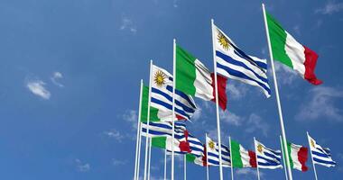 Uruguay and Italy Flags Waving Together in the Sky, Seamless Loop in Wind, Space on Left Side for Design or Information, 3D Rendering video