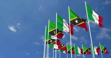 Saint Kitts and Nevis and Italy Flags Waving Together in the Sky, Seamless Loop in Wind, Space on Left Side for Design or Information, 3D Rendering video