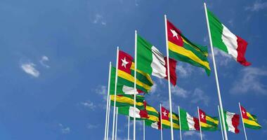 Togo and Italy Flags Waving Together in the Sky, Seamless Loop in Wind, Space on Left Side for Design or Information, 3D Rendering video