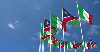 Namibia and Italy Flags Waving Together in the Sky, Seamless Loop in Wind, Space on Left Side for Design or Information, 3D Rendering video