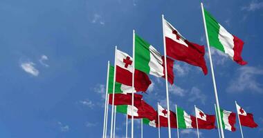 Tonga and Italy Flags Waving Together in the Sky, Seamless Loop in Wind, Space on Left Side for Design or Information, 3D Rendering video