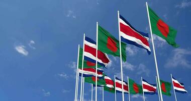 Costa Rica and Bangladesh Flags Waving Together in the Sky, Seamless Loop in Wind, Space on Left Side for Design or Information, 3D Rendering video