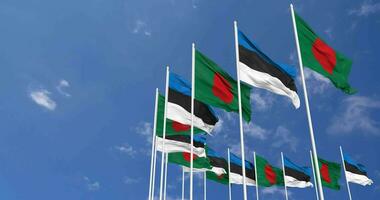 Estonia and Bangladesh Flags Waving Together in the Sky, Seamless Loop in Wind, Space on Left Side for Design or Information, 3D Rendering video