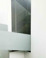 Abstract architectural detail with blinds and partial wall, minimalist design. photo