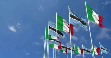 botswana och Italien flaggor vinka tillsammans i de himmel, sömlös slinga i vind, Plats på vänster sida för design eller information, 3d tolkning video