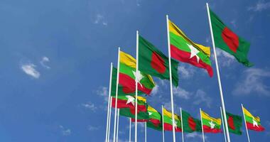 Myanmar, Burma and Bangladesh Flags Waving Together in the Sky, Seamless Loop in Wind, Space on Left Side for Design or Information, 3D Rendering video