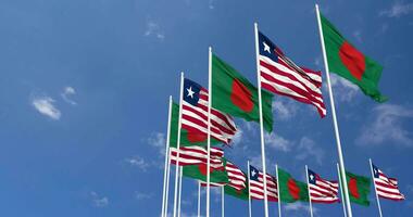 Liberia and Bangladesh Flags Waving Together in the Sky, Seamless Loop in Wind, Space on Left Side for Design or Information, 3D Rendering video