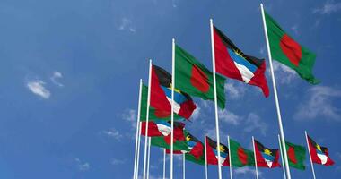 Antigua and Barbuda and Bangladesh Flags Waving Together in the Sky, Seamless Loop in Wind, Space on Left Side for Design or Information, 3D Rendering video